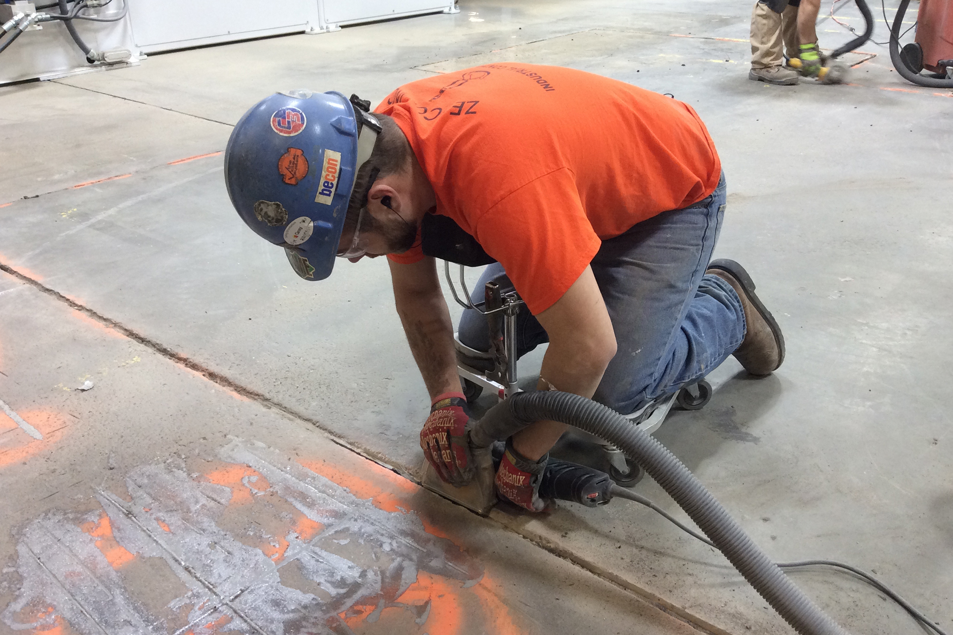 professional maintains a concrete expansion joint